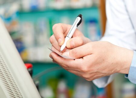 Portrait of a pharmacist in his shopの写真素材