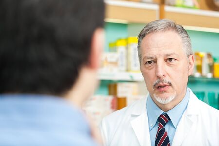 Portrait of a pharmacist in his shopの写真素材