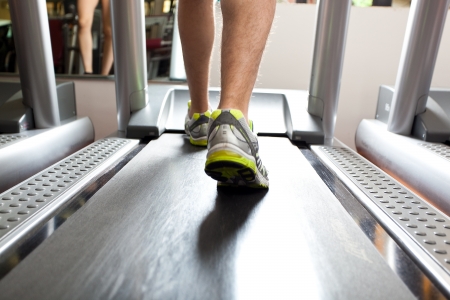 People using treadmills in a fitness clubの写真素材