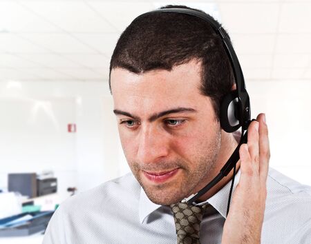 Portrait of an handsome customer representative at workの写真素材
