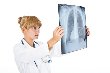 Portrait of a doctor examining a radiography. Isolated on white