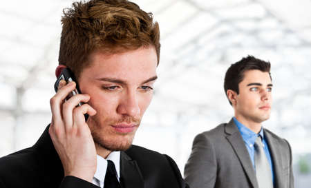 Handsome executive talking on the phoneの写真素材