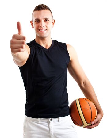 Young athlete holding a basketballの写真素材