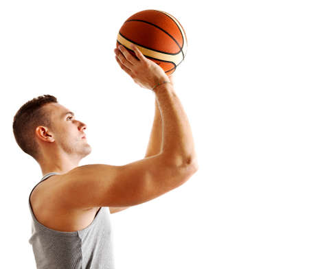 Young athlete holding a basketballの写真素材
