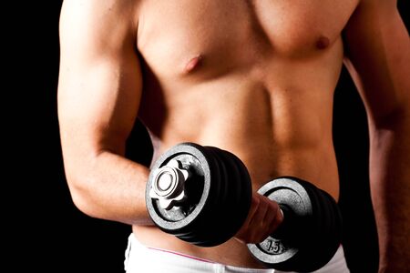 Muscular man lifting weightsの写真素材