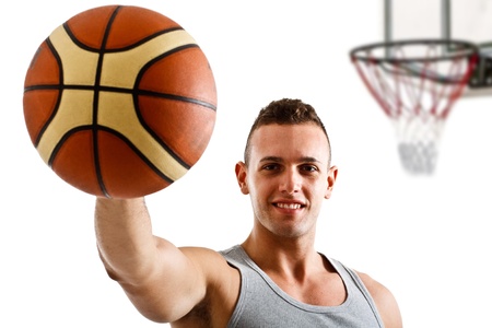 Young athlete holding a basketballの写真素材