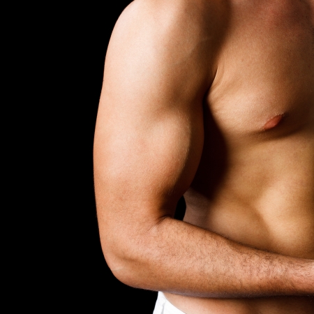 Fitness man showing his musclesの写真素材