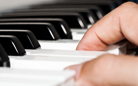 Close up of a musician playing a piano keyboardの写真素材