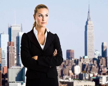 Businesswoman and skyscrapers in the backgroundの写真素材