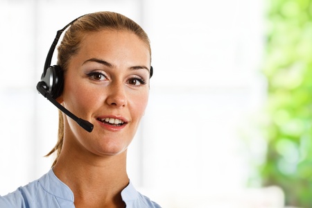 Portrait of a beautiful customer representative at workの写真素材