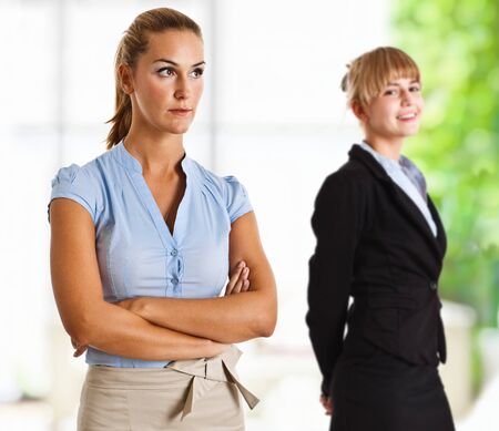 Indoor portrait of two beautiful businesswomenの写真素材