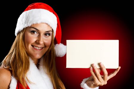 Portrait of a beautiful girl wearing Santa Claus clothesの写真素材