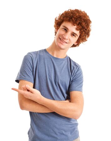 Portrait of a young man pointing his finger to the leftの写真素材