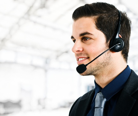 Portrait of an handsome customer representative at workの写真素材