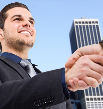 Portrait of businessmen shaking handsの写真素材
