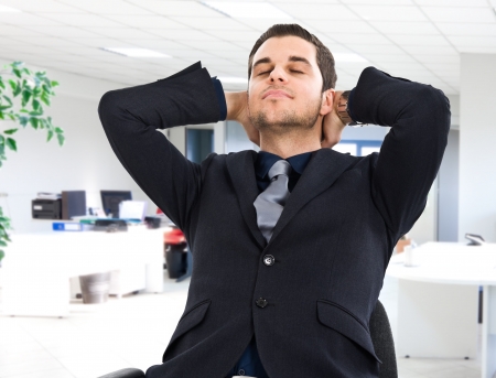Businessman relaxing on his chairの写真素材