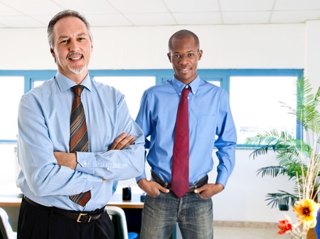 Portrait of two businessmen in an officeの写真素材