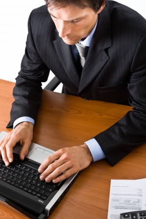 Worker using a laptop computerの写真素材