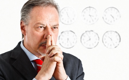 Pensive businessman trying to solve a problem on time