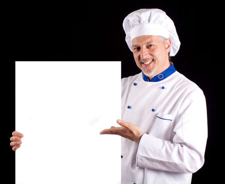 Portrait of an handsome chef showing a blank menu
