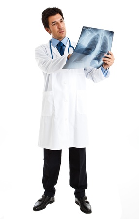 Portrait of a doctor looking at a radiographyの写真素材
