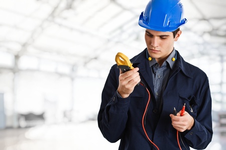 Electrician looking at a testerの写真素材