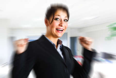 Portrait of an happy winning woman の写真素材