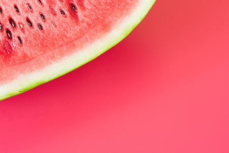 Watermelon slice on a vibrant backgroundの写真素材