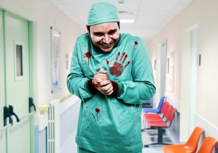 Crazy surgeon waiting for a new patientの写真素材