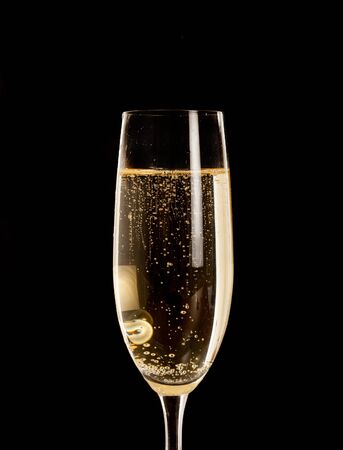 Champagne flute isolated on blackの写真素材