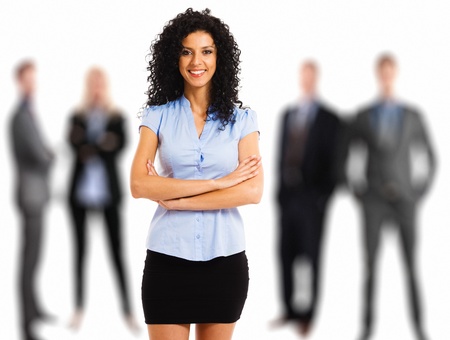Portrait of a young beautiful businesswoman in front of her teamの写真素材