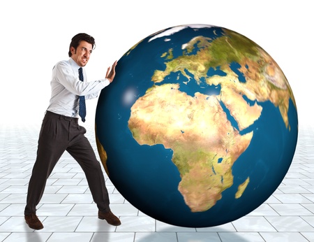 Businessman trying to make the world go roundの写真素材