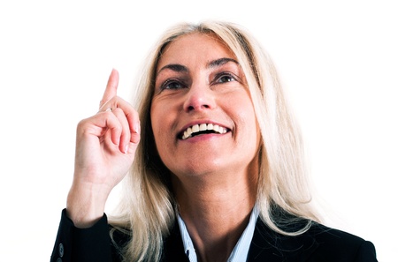 Portrait of a business woman pointing her finger upの写真素材