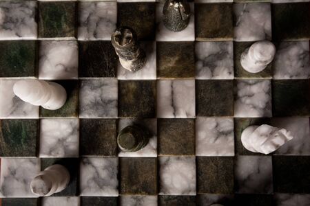 Chess pieces on a marble board