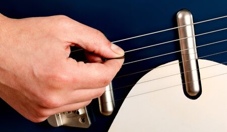 Close-up of a guitar player