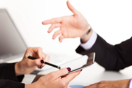 Details of people at work in a business environmentの写真素材