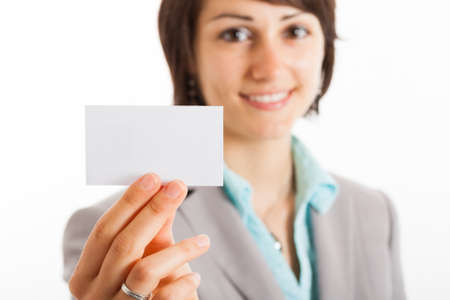 Businesswoman showing a blank business cardの写真素材