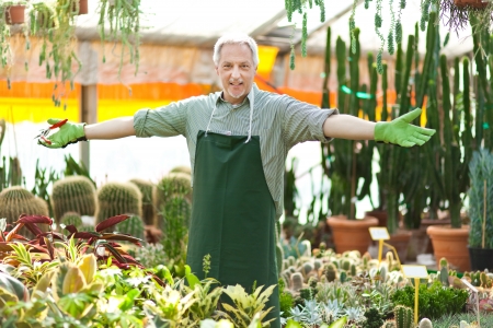 Portrait of a smiling greenhouse workerの写真素材