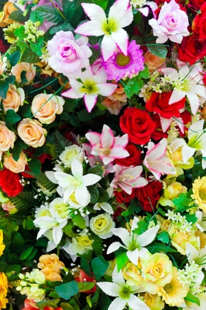 Composition of artificial flowers in a greenhouseの写真素材