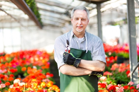 Portrait of a smiling greenhouse workerの写真素材