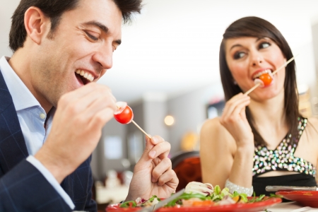 Couple having dinner in a restaurantの写真素材
