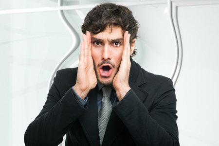 Portrait of an astonished businessmanの写真素材
