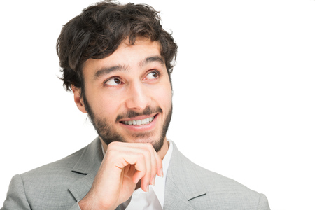 Portrait of a young handsome man looking up  Isolated on whiteの写真素材