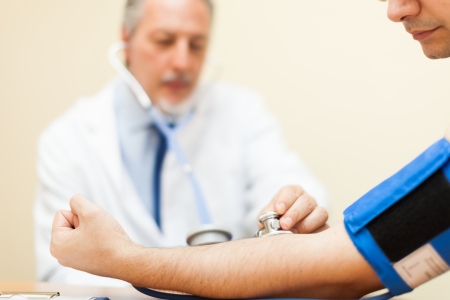 Doctor checking blood pressureの写真素材