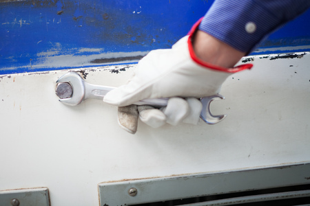 Worker using a wrenchの写真素材