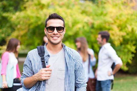 Outdoor portrait of a smiling studentの写真素材