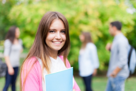 Outdoor portrait of a smiling studentの写真素材