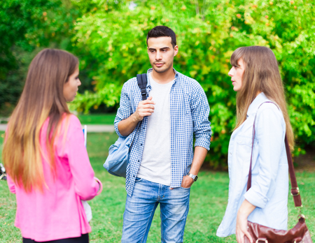 Group of students talking in a parkの写真素材