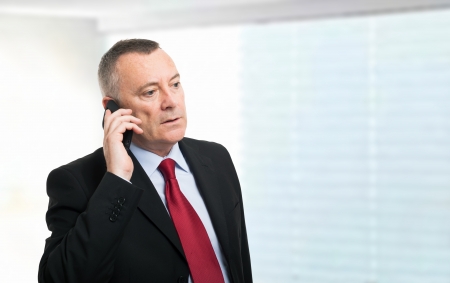 Portrait of a businessman talking on the phoneの写真素材