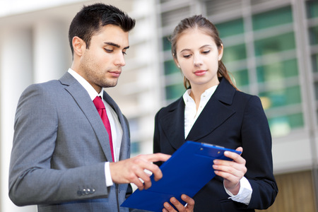 Two business people discussing outdoor Two business people discussing outdoor